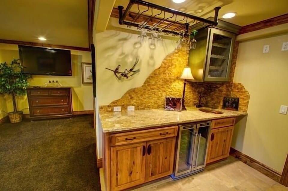 Lower level wet bar with wine and champagne cooler.