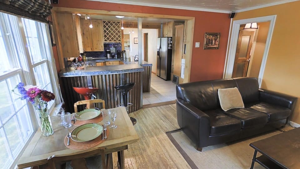 Living room with kitchen in background