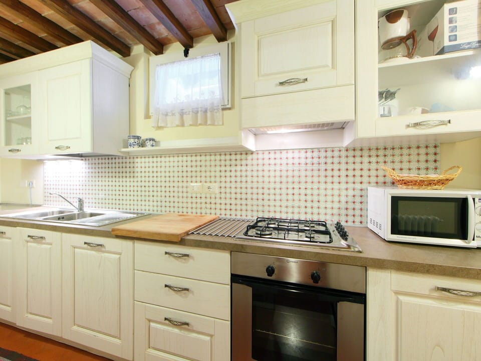 Countertop, Cabinetry, Room, Furniture, Kitchen, Property, Tile, Floor, Interior Design, Sink