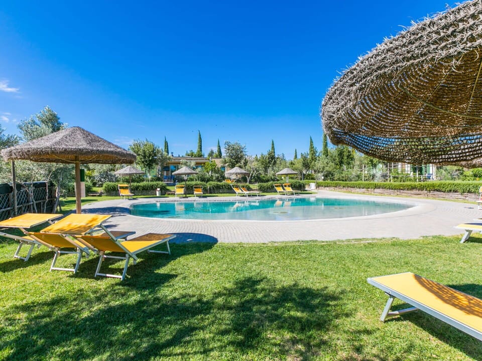 Water, Plant, Sky, Swimming Pool, Azure, Botany, Outdoor Furniture, Shade, Architecture, Tree