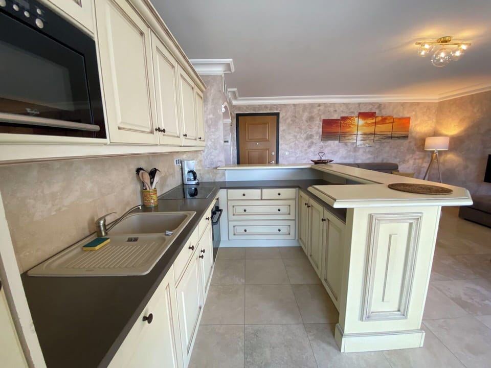 Countertop, Kitchen, Cabinetry, Flooring, Furniture, Interior Design, Kitchen Appliance, Wood, Floor, Home