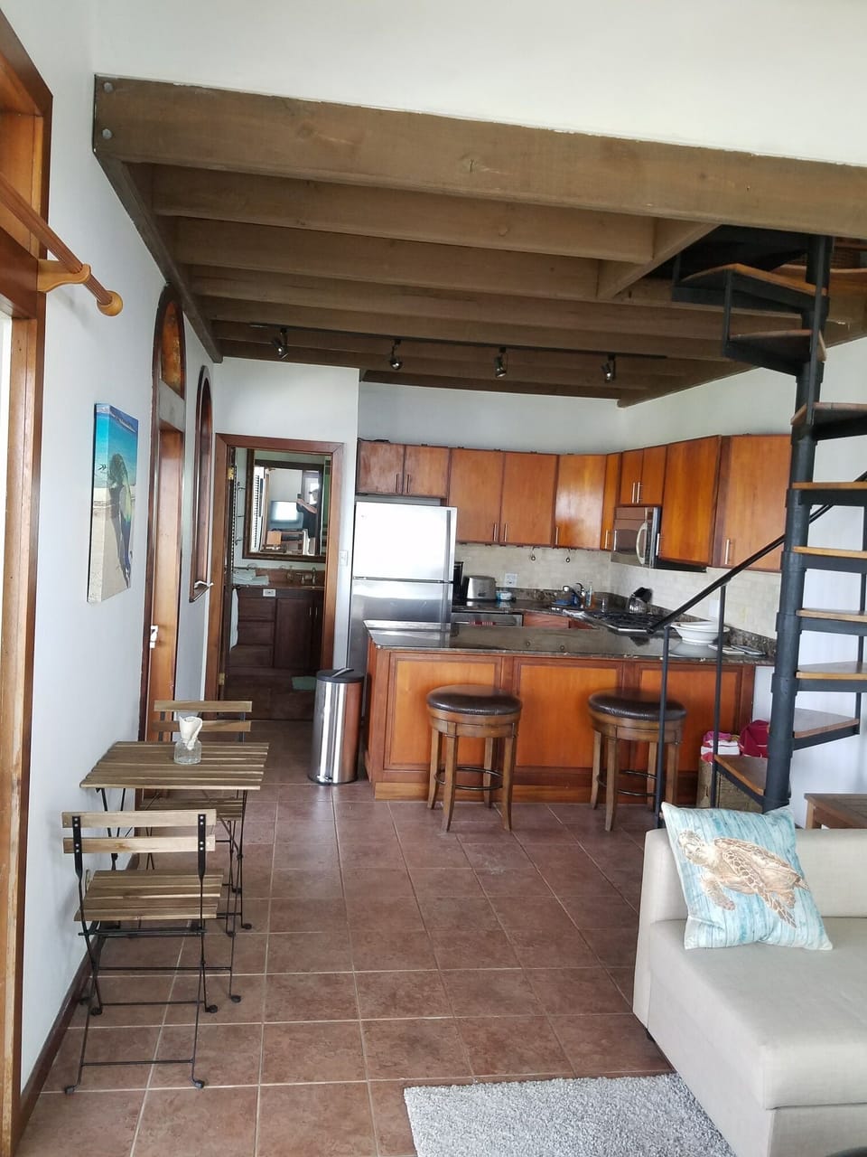 We’ll stocked kitchen and spiral staircase to loft bedroom