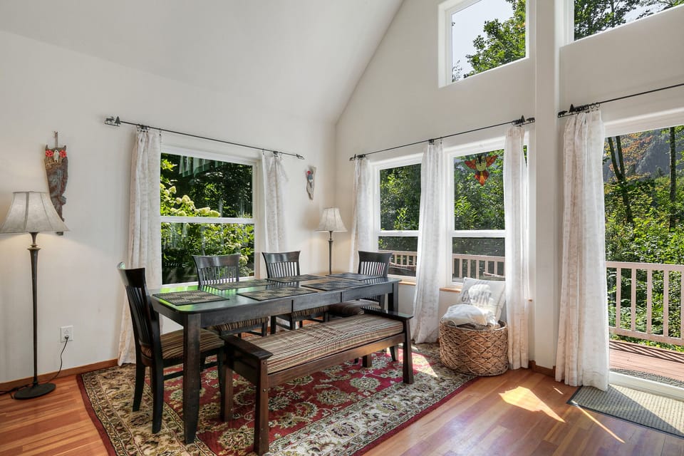 Just past the kitchen in the open grand room is a dining table for 6