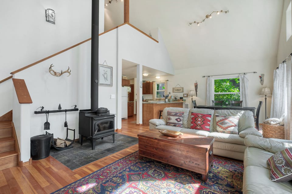 Wood stove - one bundle of long-burning pressed logs provided. Stairs in the back lead to loft bed