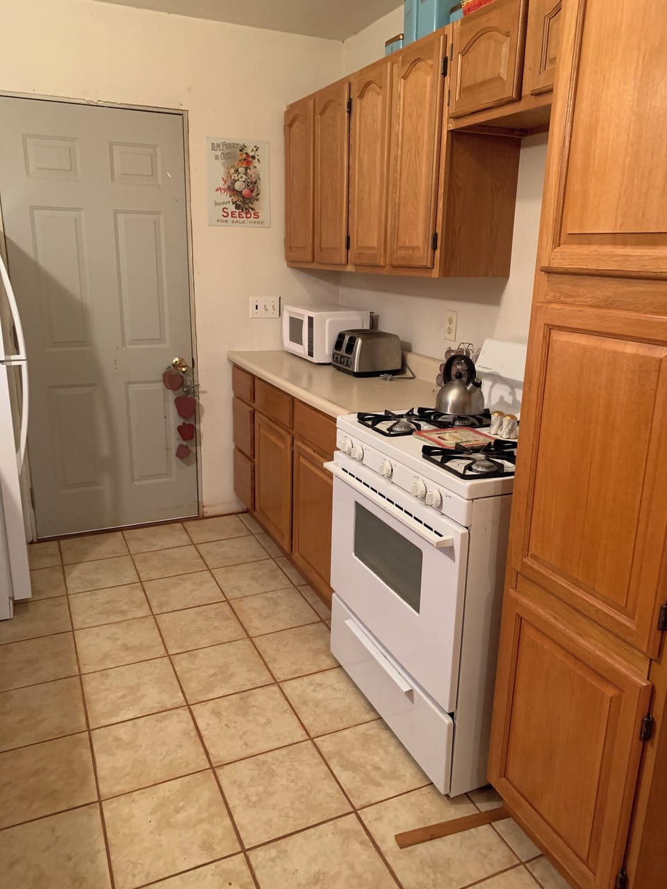 Kitchen with new heated tile flooring.