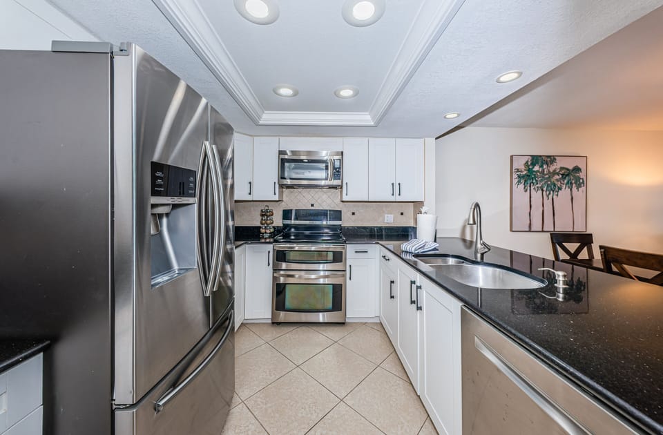 Granite Kitchen with a wine chiller and fully stocked for meals away from home!