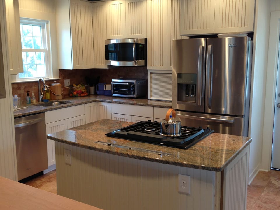 Open kitchen with granite countertops and stainless steel appliances
