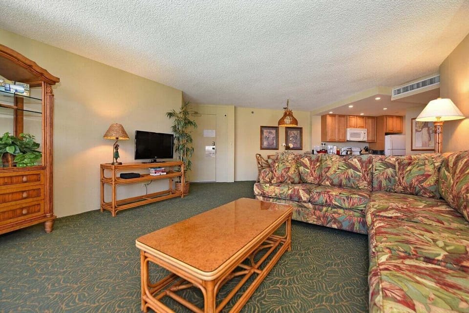 Relax in the inviting living room, complete with a comfortable L-shape sleeper sofa
