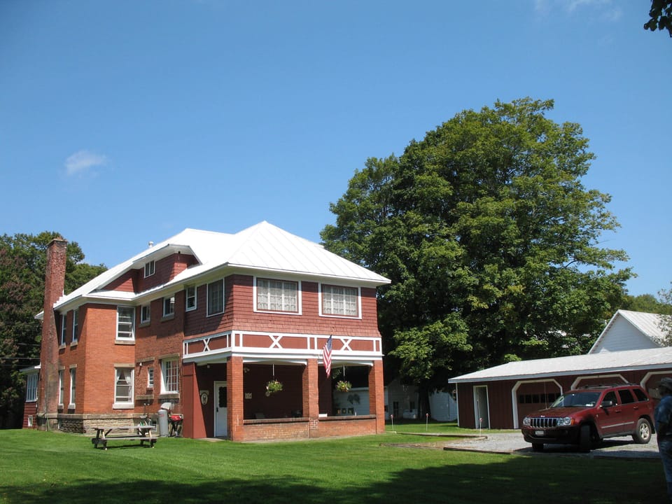 Spacious backyard, parking, patio, grill and picnic area.