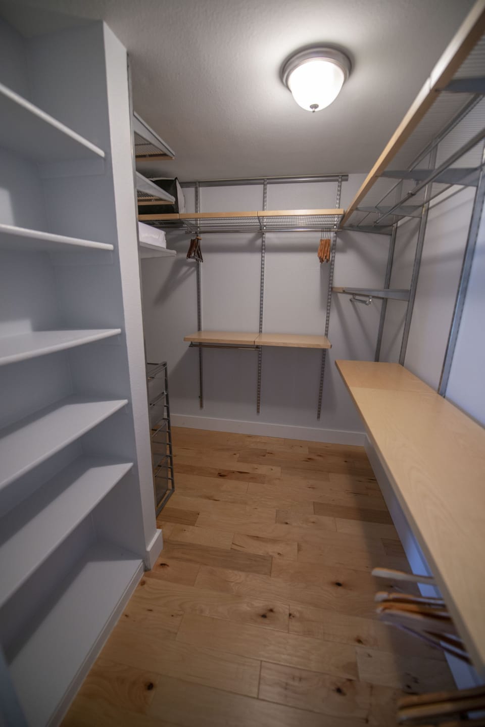 Walk-in closet in master bedroom.