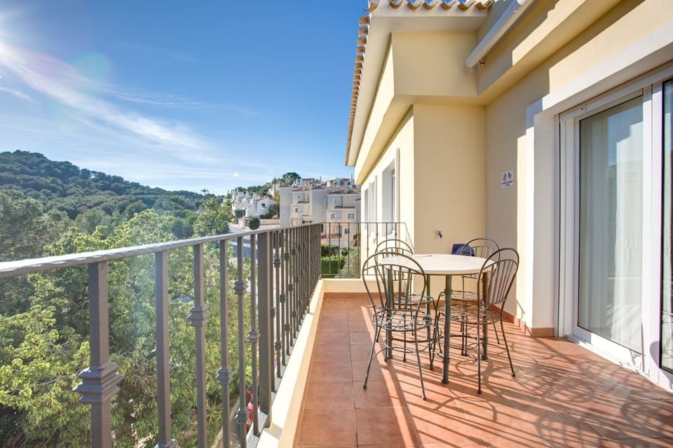 Balcony with awning and  seating.