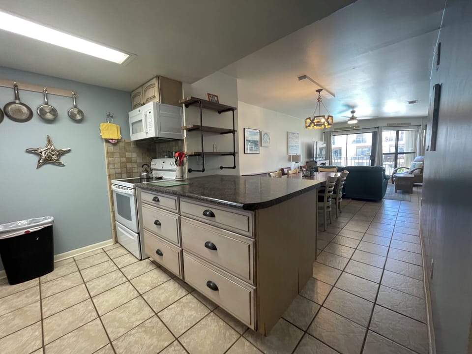 Well stocked kitchen open to the dining and living room areas