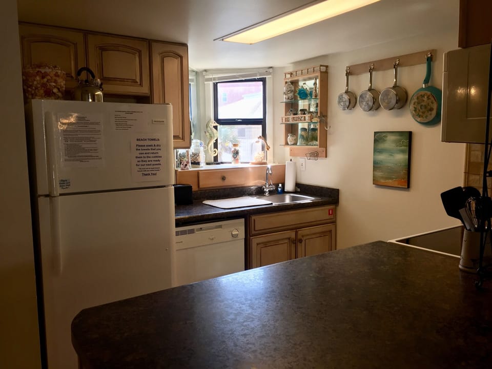 Kitchen window offers mirrored view of the ocean, large countertop for food prep