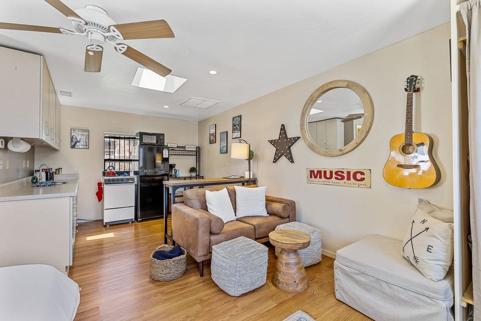 The living room area, dining bar, kitchen, coffee bar and kitchen.