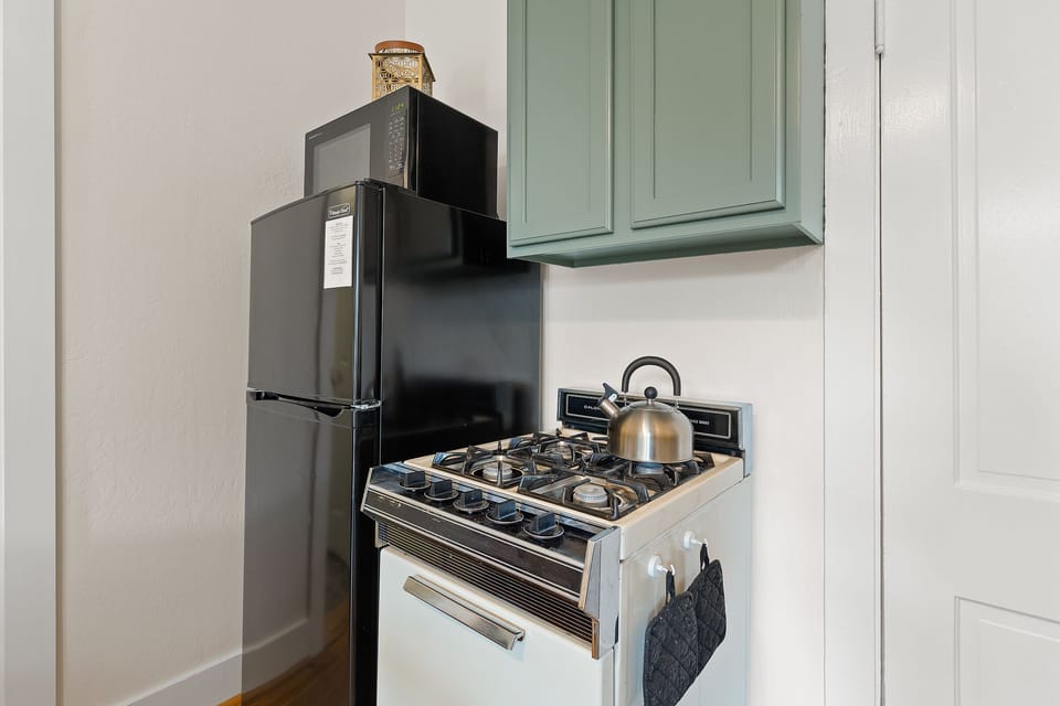 Kitchen refrigerator and stove. 