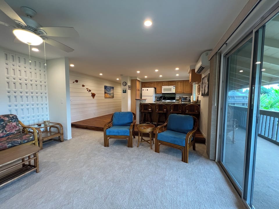 Living room, kitchen and entryway