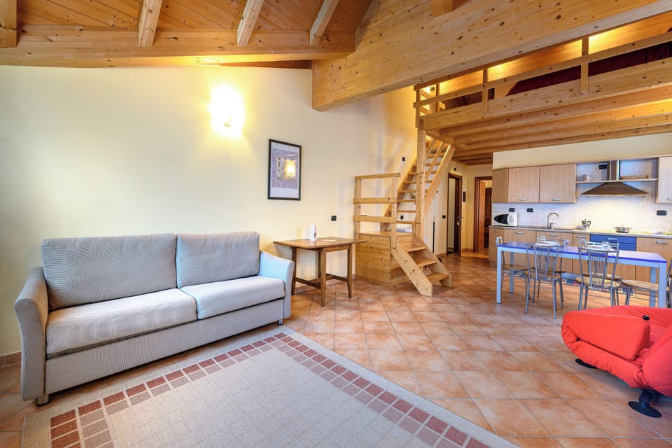 Deluxe Apartment | Living area | 32-inch flat-screen TV with digital channels, TV
