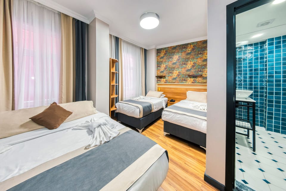 Family Room | Minibar, in-room safe, individually decorated, individually furnished