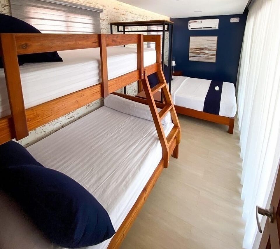 Family Cabin, Sea Facing | Minibar, in-room safe, blackout drapes, bed sheets