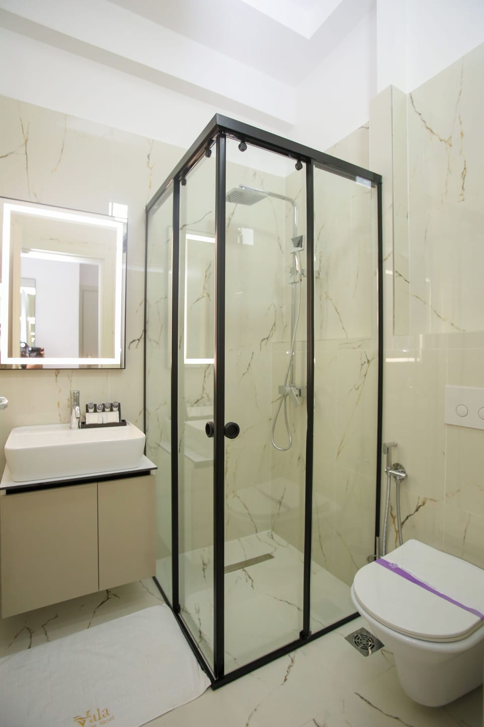 Superior Triple Room, Partial Sea View | Bathroom | Shower, free toiletries, hair dryer, towels
