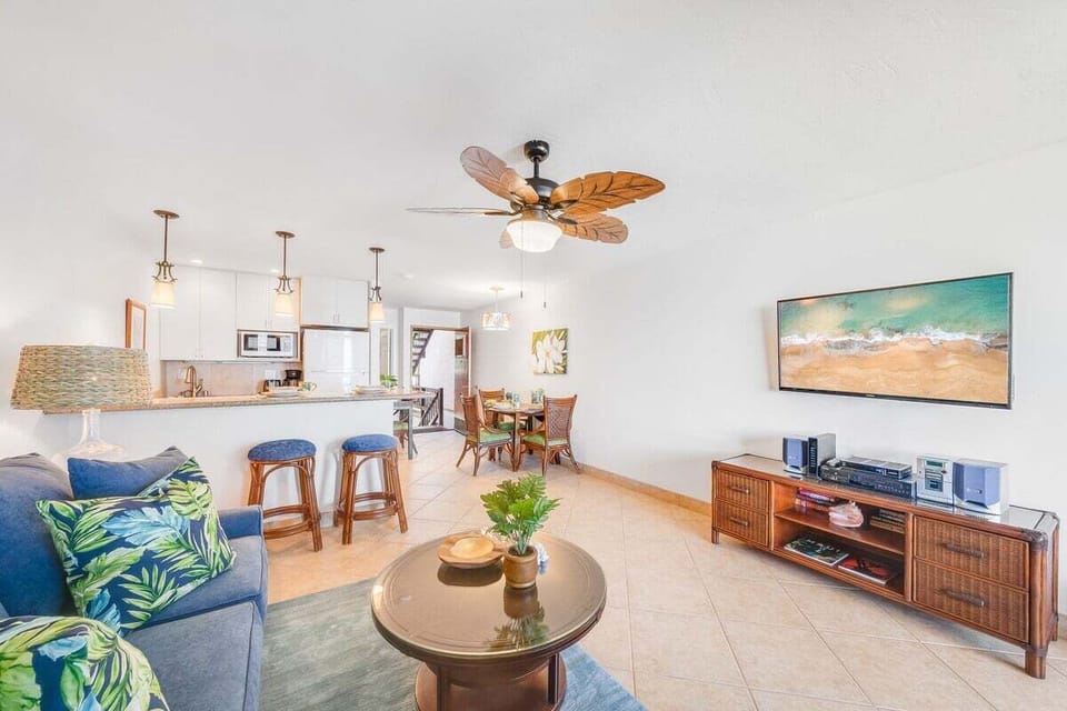 Living room flowing into dining area, perfect for relaxing after the beach.