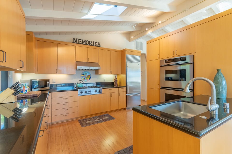 Gourmet quartz kitchen with gas range! Sub Zero refrigerator. Double ovens. 