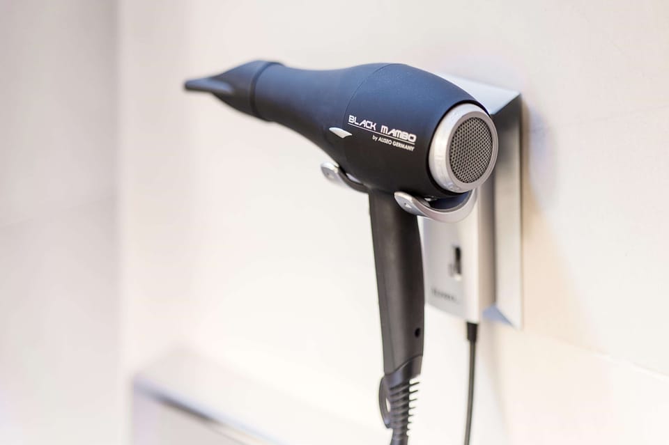 Bathtub, rainfall showerhead, eco-friendly toiletries, hair dryer