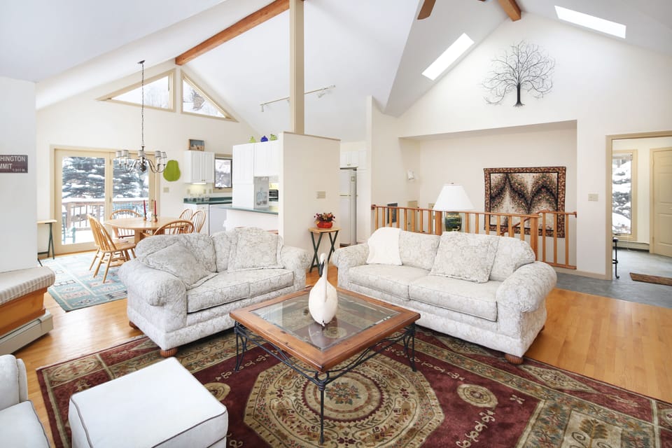 Open Concept Living Area with LOTS of Natural Light and Sweeping Views of Nature