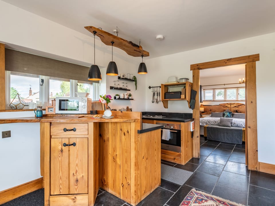 Cottage | Private kitchen | Fridge, microwave, stovetop, highchair