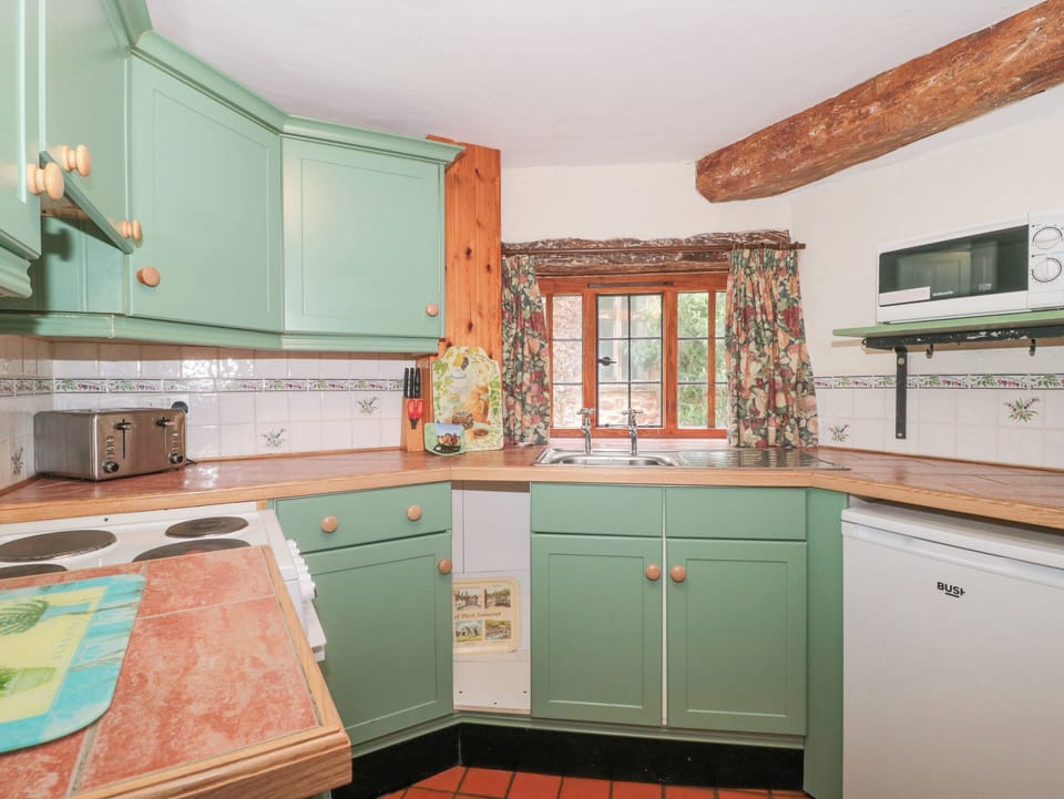 Cottage | Private kitchen | Fridge, microwave, stovetop, highchair