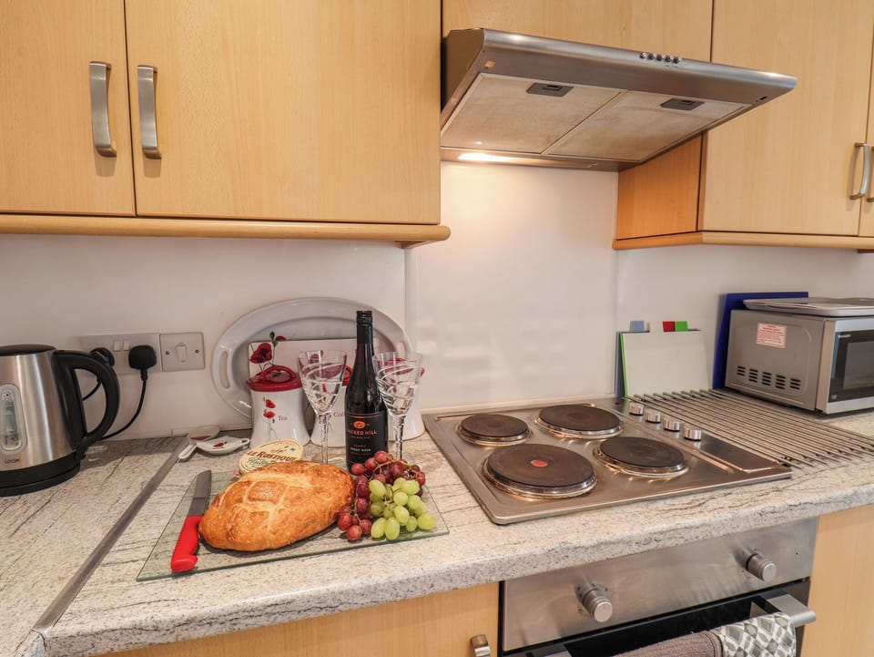 Cottage | Private kitchen | Fridge, microwave, stovetop, highchair