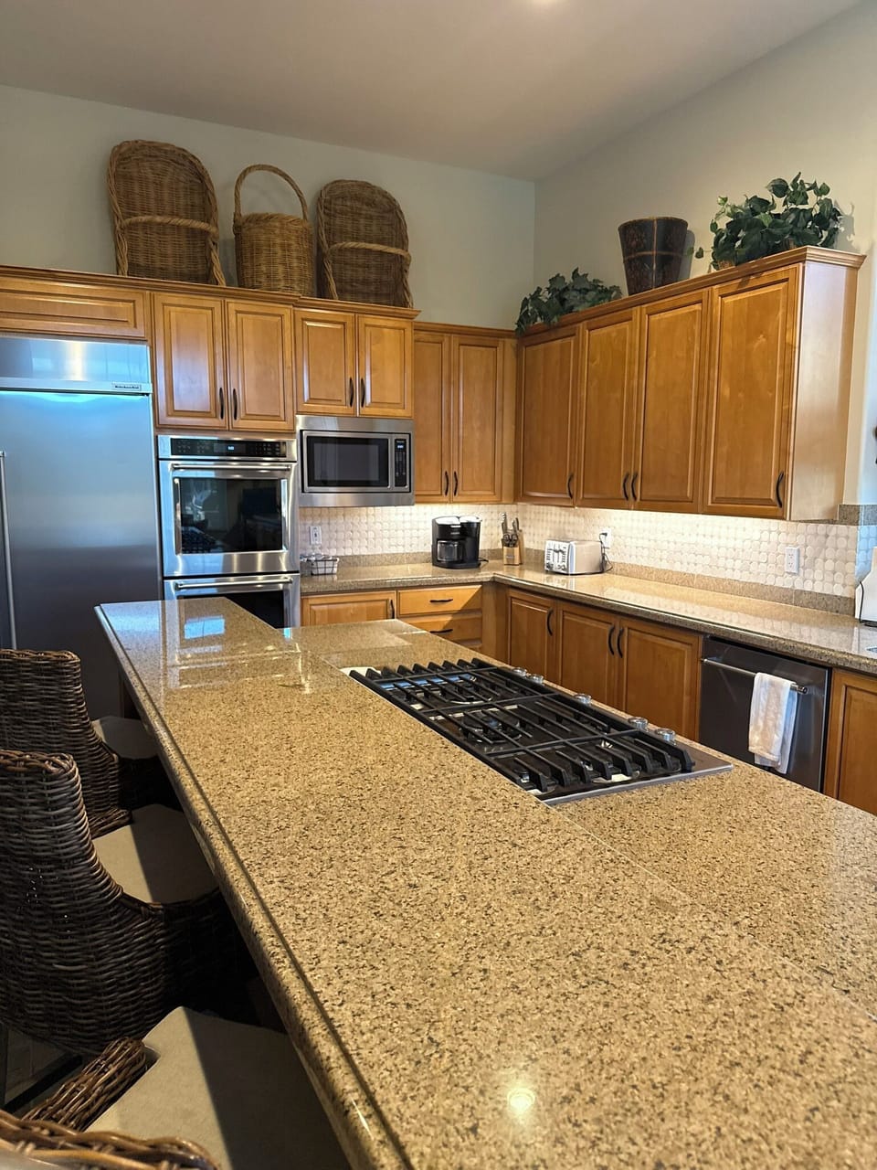 Kitchen has double oven and five burner stovetop.