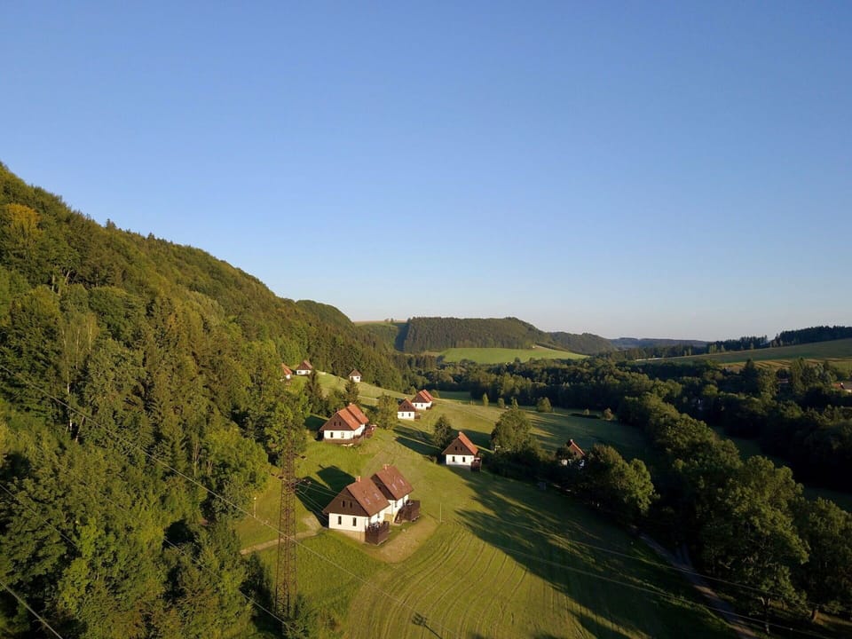 Mountainous Landforms, Sky, Hill, Natural Landscape, Mountain, Rural Area, Highland, Tree, Grass, House
