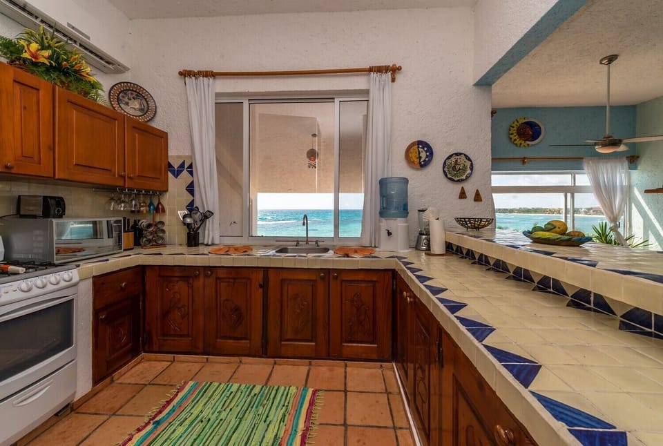Kitchen with purified water provided - La Sirena condo 14 Akumal Mexico vacation rental 2 king bedrooms with 2 baths.