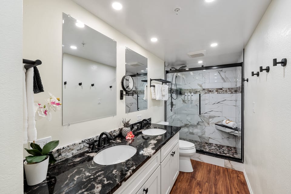 Refresh in the renovated primary bathroom with a modern vanity and shower.