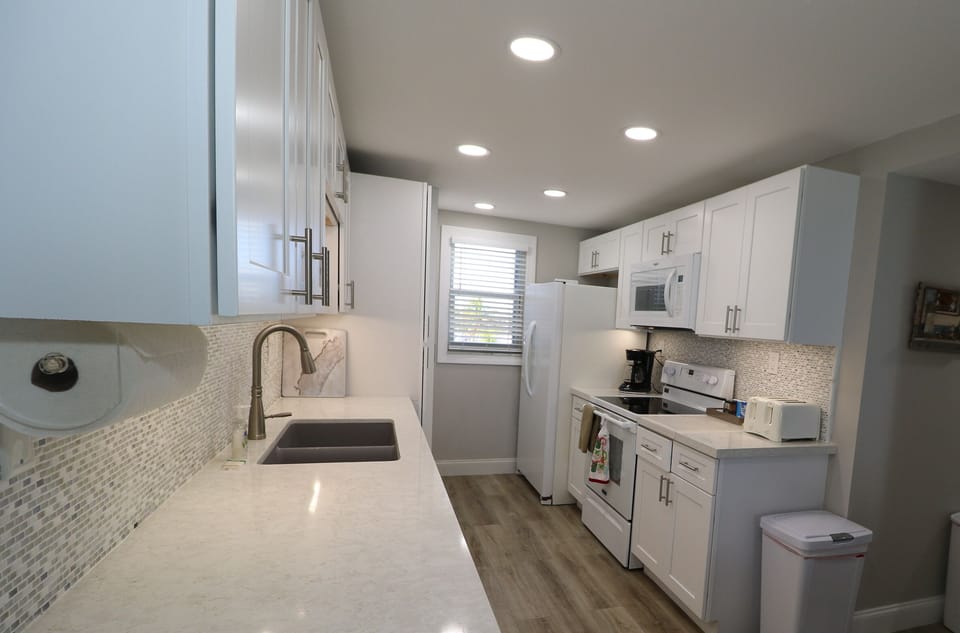 New ceiling,counter, floor and lighting in the kitchen .