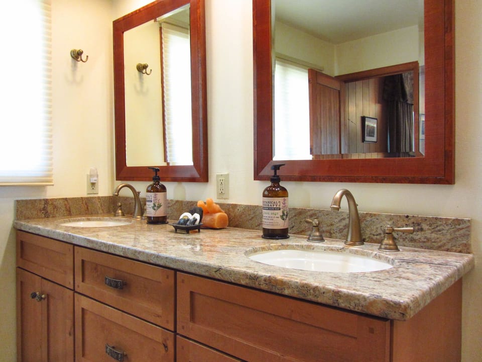 Double sinks and custom Tahoe toiletries in the luxury master bathroom