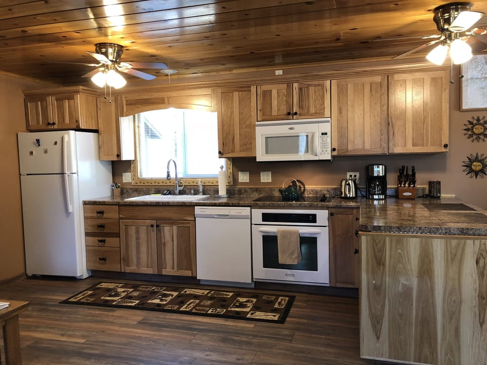 Appliances include fridge with ice maker, dishwasher, oven, microwave, coffee maker, all kitchen essentials for making your meals(pots, pans, dishes)