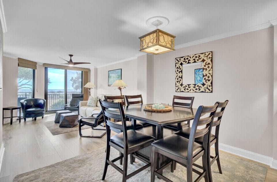 You'll love gathering around this elegant dining table with stylish seating for six, perfectly positioned near your bright living area.