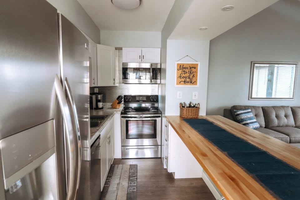 Kitchen with brand new stainless appliances. Convenient USB located on bar.