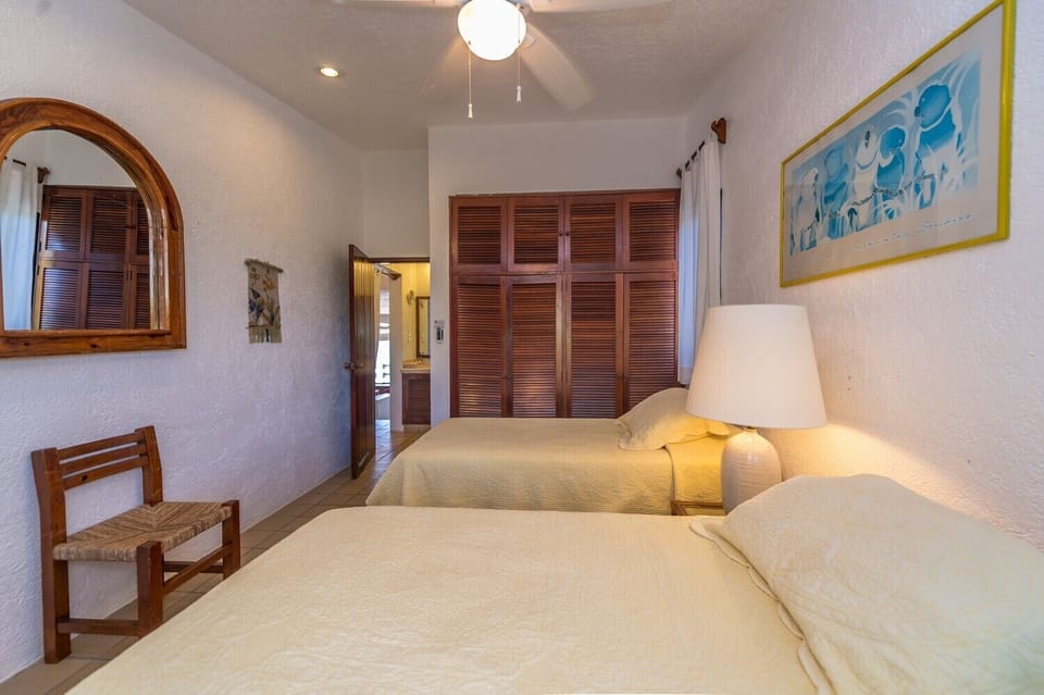 Guest Bedroom 2 twins or 1 king - Yool Caanal Condominiums, unit 4, 2nd level Akumal Mexico vacation rental with 2 bedrooms