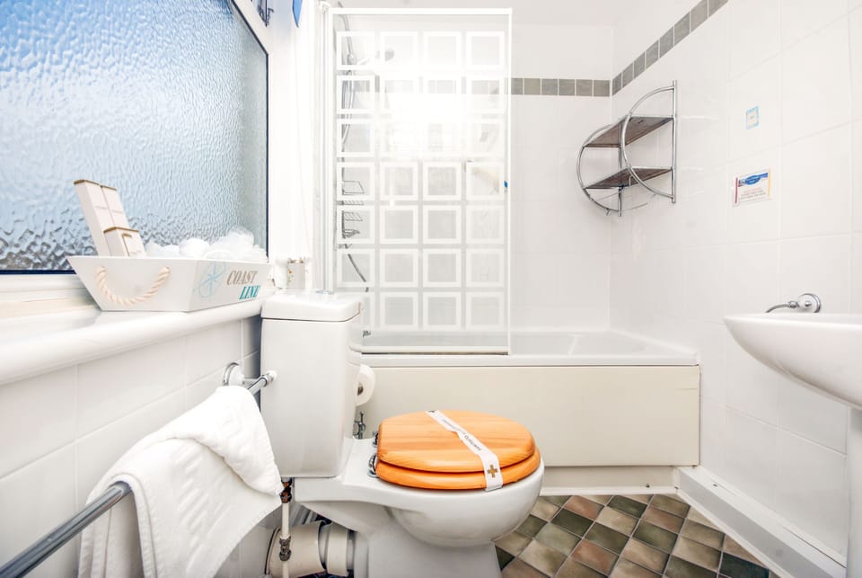 Designer toiletries, hair dryer, towels, soap