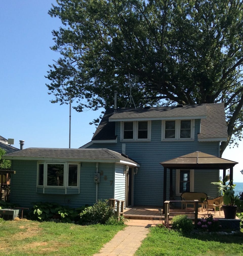 Walk up to house in back, sitting area under gazebo with bbq area. 