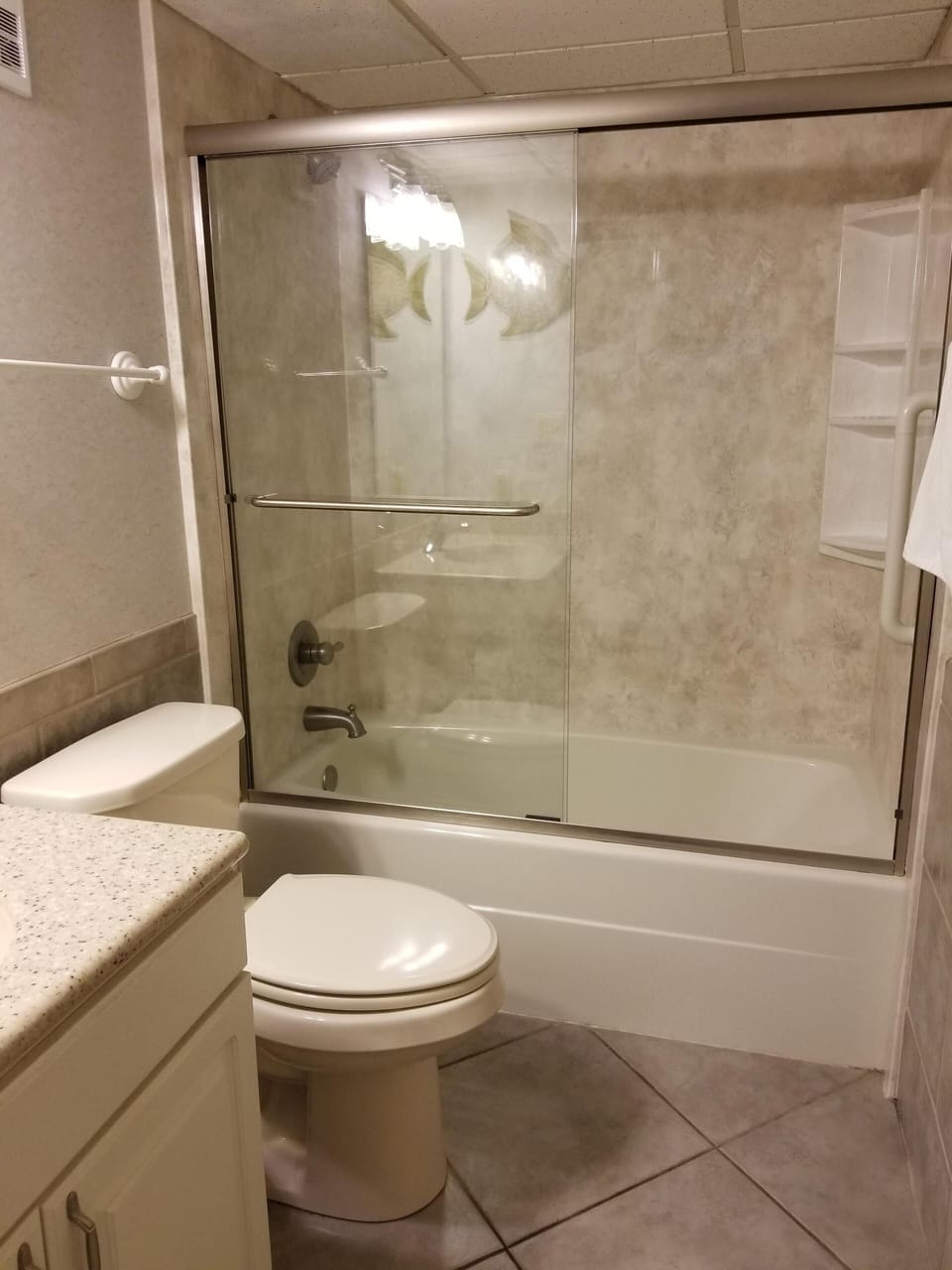 Guest bathroom with access from guest bedroom and hall.