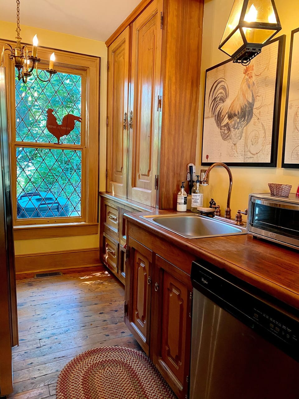 Fully stocked kitchen with stainless appliances. 