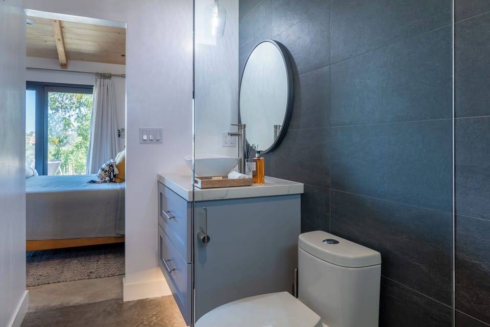 Refresh at the modern vanity in this open, light-filled suite.