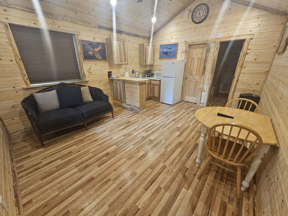 Aviation Cabin 27 (No Pets) | Living area | 32-inch flat-screen TV with satellite channels