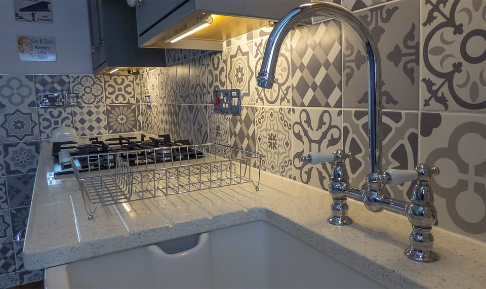 Kitchen lighting and butler sink.