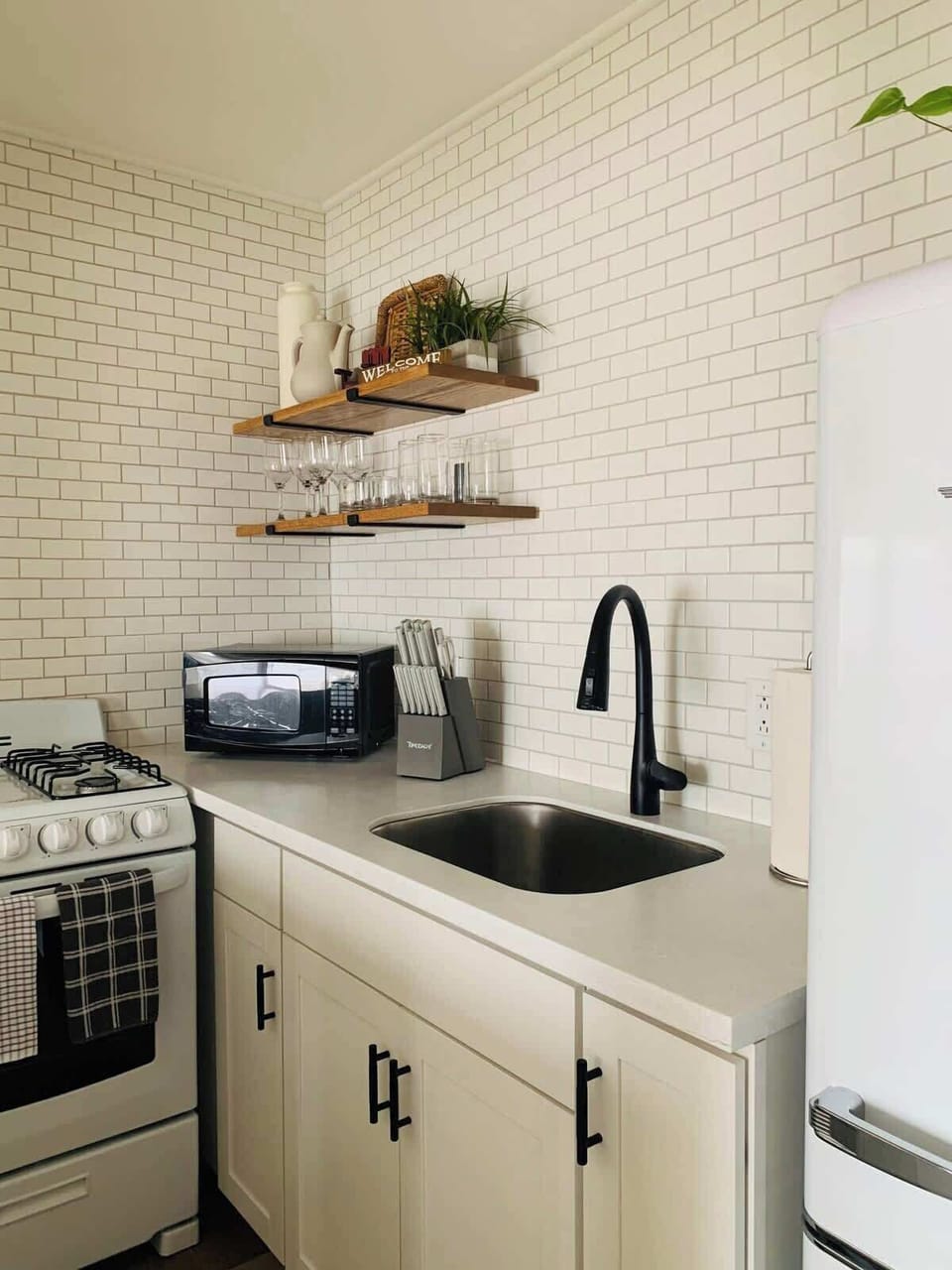 Upstairs Kitchen- Fully stocked kitchen with everything you need to cook, snack, or sip.