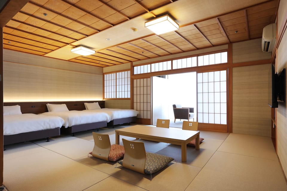 Modern Japanese Triple Room with Open-air Bath, Non Smoking | In-room safe, bed sheets